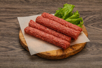 Raw beef sausages with spices