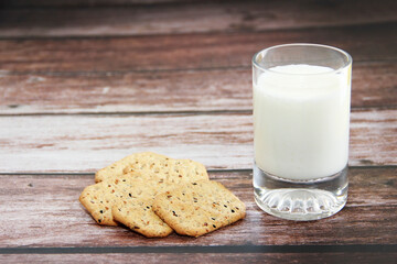 white kefir in a glass and crunchy diet crackers