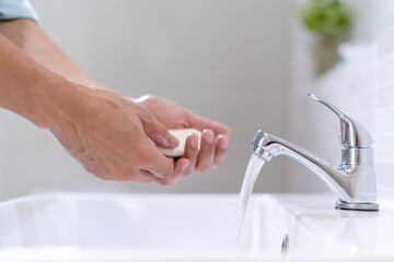 Personal hands wash with soap bubbles and rinse with clean water. Good health