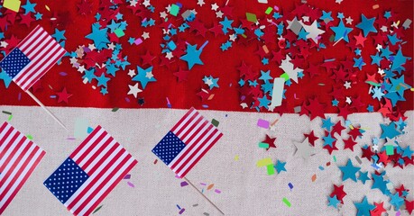 Composition of american flags, over confetti and stars, on red and white