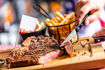 Beef steak in american restaurant - obrazy, fototapety, plakaty
