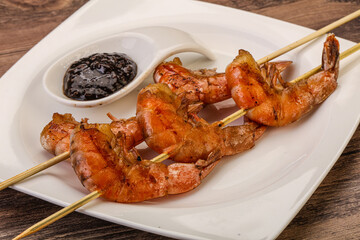 Grilled prawn skewer with pepper sauce