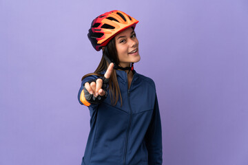 Teenager cyclist girl showing and lifting a finger