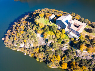 Aerial view of Benedictine monastery of Sant Pere de Casserres on Ter river in autumn