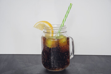 summer refreshing cola drink with lemon