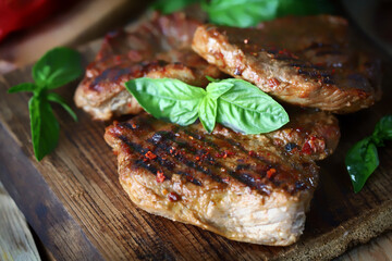 Selective focus. Appetizing juicy grilled steak. Close-up.