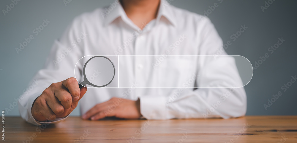 Fototapete Data Search Technology Search Engine Optimization. man's hands are using a magnifying glass.to Searching for information. Using Search Console with your website.