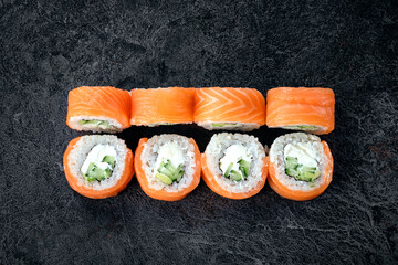 Classic Philadelphia sushi roll set with salmon and cream cheese. Japanese dish of fresh salmon and...
