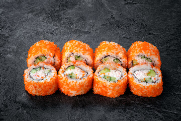 California sushi roll set with crab, cucumber and tobiko caviar. Japanese dish of crab meat with rice. Close-up