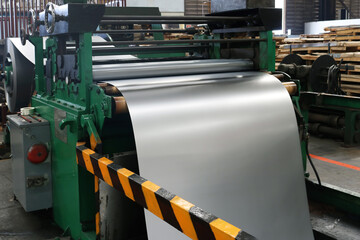 Cold rolled steel sheet on rolling machine in production process at factory.