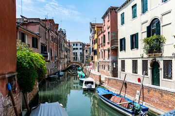 Romanic view of a Water Canal (so-called Riva) in Venice, Italy. These waterways are the main means of transport in the city