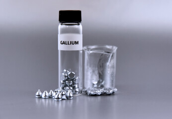 Gallium solid state metal stock images. Laboratory accessories stock photo. Laboratory equipment on a silver background. Ga, chemical element stock images - obrazy, fototapety, plakaty