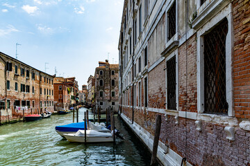 Obraz premium A Water Canal (so-called Riva) in Venice, Italy. These waterways are the main means of transport in the city