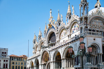 Basilica di San Marco or St Mark's Basilica, Venice, Italy. Details of the luxury facade. Ornate detail of the landmark of Venice in summer.