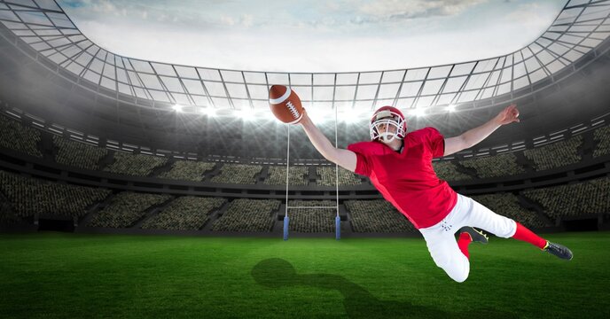 Composition of male american football player catching ball at stadium