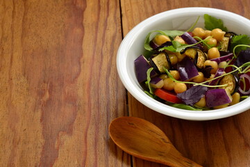 Eggplant Salad with Chickpeas and Fresh Vegetables, copy space