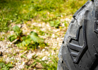 Close up of a tire in the background green nature