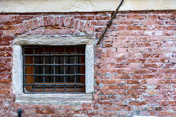 Fototapeta na wymiar Antique Window in a brick wall with copy space for text