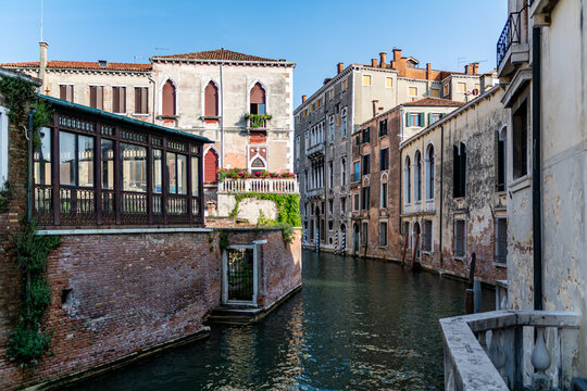 A Water Canal (so-called Riva) in Venice, Italy. These waterways are the main means of transport in the city