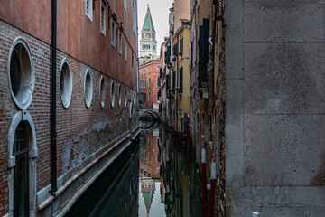 Obraz na płótnie Canvas Romanic view of a Water Canal (so-called Riva) in Venice, Italy. These waterways are the main means of transport in the city