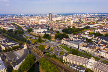 Fototapeta na wymiar Scenic aerial view of French city of Nantes at cloudy summer day