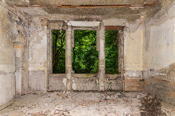 Fototapeta na wymiar A dilapidated abandoned building. Derelict houses