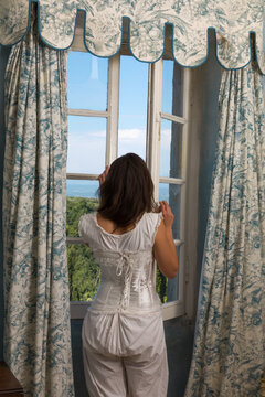 Victorian bedroom Woman at window