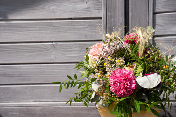 bouquet of flowers in front of a wooden background