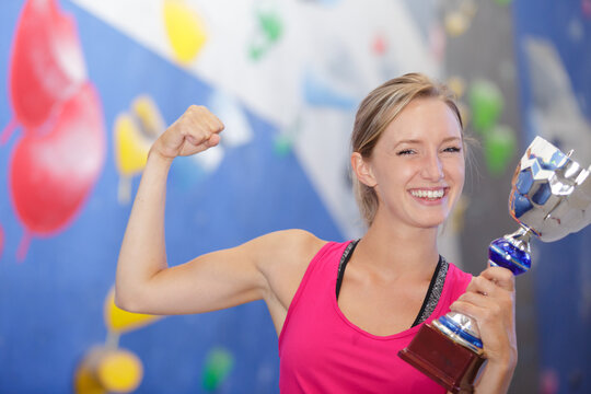 happy casual woman showing her big trophy