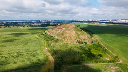 Naklejka premium Household waste landfill. Closed for processing. Environment protection. Aerial photography.