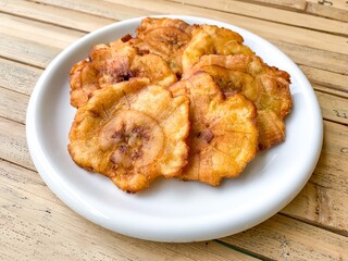 flattened fried banana with soft focus image.
