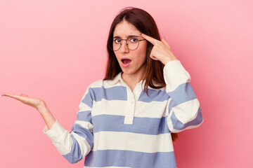 holding and showing a product on hand.