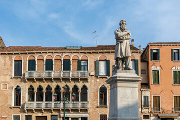 Campo Santo Stefano with historic buildings and the Monument to Niccolò Tommaseo in front 