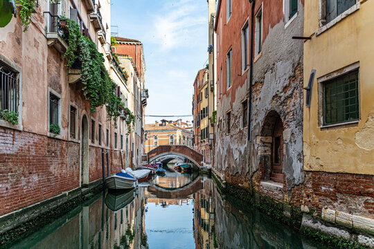 Romanic view of a Water Canal (so-called Riva) in Venice, Italy. These waterways are the main means of transport in the city