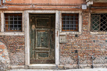 Typical Venetian door to the canal. Traditional entrance to a building in Venice, Italy