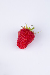 Isolated berries. Bunch of raspberry fruits with leaves isolated on white background, with clipping path