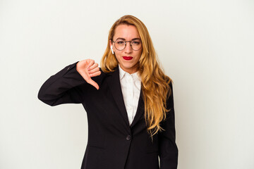 Obraz premium Caucasian business woman wearing a wireless headphones isolated on white background showing a dislike gesture, thumbs down. Disagreement concept.