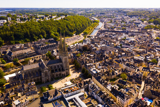 Drone view of summer cityscape of Quimper on Odet river with Gothic Roman Catholic cathedral, Brittany, France