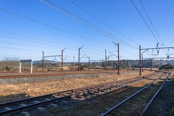 Fototapeta na wymiar Rail Tracks Train Lines Infrastructure Power Lines Transport Travel Industry Landscape.