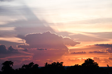 Evening sky sunset.  big puffy cumulus and long stratus clouds. sky background with clouds