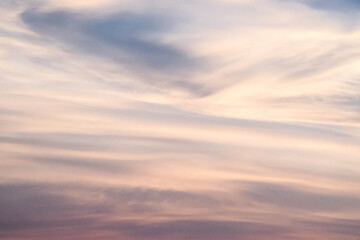 Evening sky sunset.  big puffy cumulus and long stratus clouds. sky background with clouds