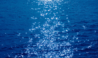 Pop art style cobalt blue colored sparkling water surface with the sea ripples
