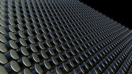 Array of metal cylindrical bodies on a black background.