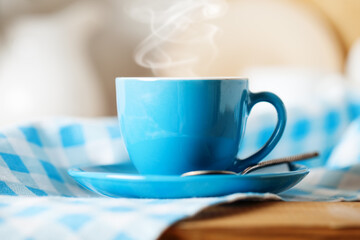 A clean blue cup in the kitchen. Mockup. Selective focus. Mock-up of a tea mug.