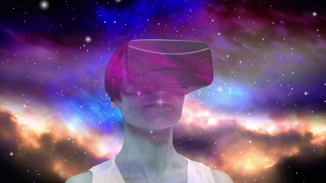 Animation of woman wearing vr headset and glowing stars over vibrant coloured clouds