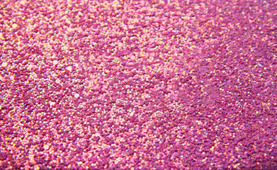 Abstract pink bright background with multicolored sparkles. Festive concept. Flat lay