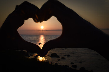 silhouette of a heart on the beach