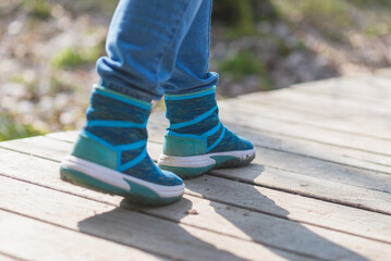 woman walk in to the wild. Travel adventure and freedom concept.Woman walking outdoor, shoes closeup