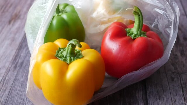 Yellow green and red capsicum on table, top view 