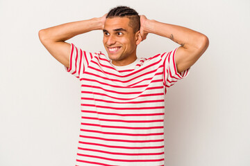 Young venezuelan man isolated on white background screaming, very excited, passionate, satisfied with something.